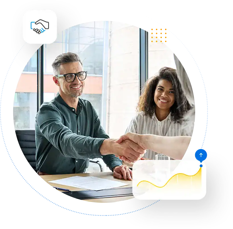 Two business partners shaking hands in a meeting
